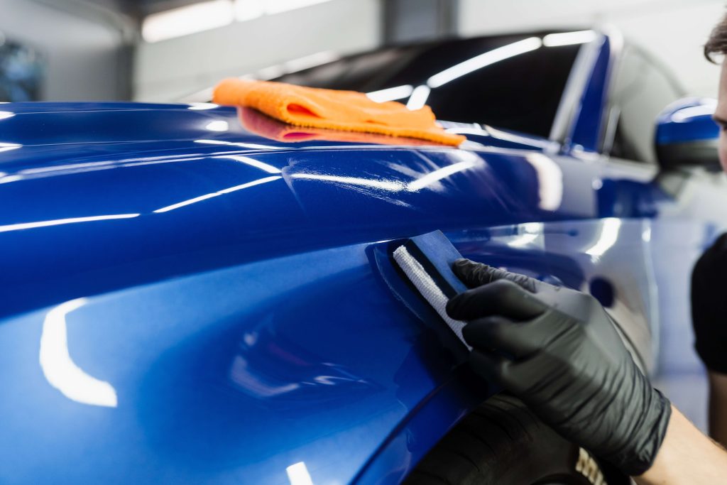 Ceramic Coating being applied to a car